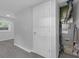 Utility room with new paint and gray flooring at 26098 Six Points Rd, Sheridan, IN 46069