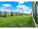 Expansive backyard view highlighting the community landscaping and well-kept lawn at 2612 Ruffian Dr, Westfield, IN 46074