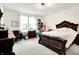 Spacious bedroom with a large bed, workspace, and bright natural light at 2612 Ruffian Dr, Westfield, IN 46074