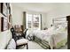Cozy bedroom with large window with view, and comfortable furnishings and decor at 2612 Ruffian Dr, Westfield, IN 46074