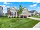 Charming single-story home with a well-manicured lawn and beautiful landscaping at 2612 Ruffian Dr, Westfield, IN 46074
