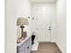 Entry hallway featuring a stylish console table, lamp, and a welcoming front door at 2612 Ruffian Dr, Westfield, IN 46074