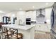 Modern kitchen with white cabinetry, stainless steel appliances, and an island with seating at 2612 Ruffian Dr, Westfield, IN 46074