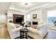 Comfortable living room featuring hardwood floors, a fireplace, and an entertainment center at 2612 Ruffian Dr, Westfield, IN 46074
