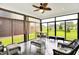 Enclosed sunroom with comfortable furniture and large windows offering backyard views at 2612 Ruffian Dr, Westfield, IN 46074