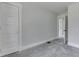 This bedroom has neutral walls and carpet and a bright window at 2860 Winthrop Ave, Indianapolis, IN 46205