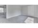 An empty bedroom featuring gray carpet and a doorway to an adjoining room at 2860 Winthrop Ave, Indianapolis, IN 46205