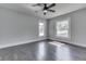 Inviting bedroom with hardwood floors, a ceiling fan, neutral paint, and great natural light at 2860 Winthrop Ave, Indianapolis, IN 46205