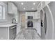 Well-lit kitchen featuring stainless steel appliances, white cabinetry, and modern countertops at 2860 Winthrop Ave, Indianapolis, IN 46205