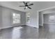 Comfortable living room boasts hardwood floors, a ceiling fan, and transitions to other rooms at 2860 Winthrop Ave, Indianapolis, IN 46205