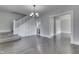 Spacious living room showcasing hardwood floors, staircase, and seamless transition to other rooms at 2860 Winthrop Ave, Indianapolis, IN 46205