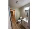 Bright bathroom showcasing a modern vanity, toilet, and doorway view to another room at 2951 S Elizabeth St, Indianapolis, IN 46203