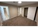 Bedroom with neutral walls, carpet, an open closet and two doorways to other rooms at 2951 S Elizabeth St, Indianapolis, IN 46203