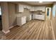 Well-lit kitchen features white cabinetry, granite countertops, and new flooring at 2951 S Elizabeth St, Indianapolis, IN 46203