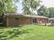 Exterior brick home with a wood deck and a large backyard at 343 E Waterbury Rd, Indianapolis, IN 46227