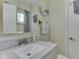 Bathroom featuring a modern vanity, neutral color scheme, and a large mirror at 343 E Waterbury Rd, Indianapolis, IN 46227