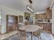 Cozy dining area with natural light, stylish rug, and a charming display cabinet at 343 E Waterbury Rd, Indianapolis, IN 46227