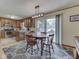 Cozy dining area with natural light, stylish rug, and views into the modern kitchen at 343 E Waterbury Rd, Indianapolis, IN 46227