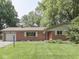 Charming single-story brick home with a well-manicured lawn and inviting curb appeal at 343 E Waterbury Rd, Indianapolis, IN 46227