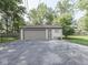 Detached garage with ample space and convenient driveway access, ideal for parking and storage at 343 E Waterbury Rd, Indianapolis, IN 46227