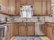 Updated kitchen with stainless steel appliances, wooden cabinets, and a functional layout at 343 E Waterbury Rd, Indianapolis, IN 46227