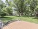 Spacious backyard featuring a deck with a bird bath and lots of trees at 343 E Waterbury Rd, Indianapolis, IN 46227