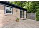 Backyard featuring brick siding, sliding door access, and a small patio at 3545 Whippoorwill Lake N Dr, Monrovia, IN 46157