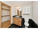 Bathroom features a black countertop vanity and a walk in closet for easy storage at 3545 Whippoorwill Lake N Dr, Monrovia, IN 46157
