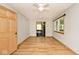 Bedroom with light gray walls, hardwood floors and a view of the ensuite bath at 3545 Whippoorwill Lake N Dr, Monrovia, IN 46157