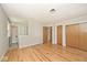 Spacious bedroom featuring hardwood floors, neutral paint, and ensuite bath access at 3545 Whippoorwill Lake N Dr, Monrovia, IN 46157