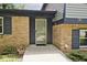 Close up view of a brick home with a glass front door at 3545 Whippoorwill Lake N Dr, Monrovia, IN 46157