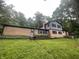 Split-level home with brick and siding exterior, complete with a backyard and surrounded by trees on a generous lot at 3545 Whippoorwill Lake N Dr, Monrovia, IN 46157