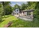 A charming two-story home with a brick facade and a spacious backyard patio at 3545 Whippoorwill Lake N Dr, Monrovia, IN 46157