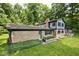 A beautiful two-story home with brick and siding, surrounded by lush greenery at 3545 Whippoorwill Lake N Dr, Monrovia, IN 46157