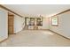 Spacious living room with staircase view into the kitchen at 3545 Whippoorwill Lake N Dr, Monrovia, IN 46157