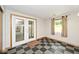 Mud room features checkered tile, french doors, and a natural light window at 3545 Whippoorwill Lake N Dr, Monrovia, IN 46157