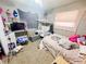 Bright bedroom featuring a bed, vanity and natural light at 3613 N Locust St, Muncie, IN 47304