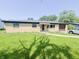 Charming brick ranch-style home featuring a well-maintained lawn and mature trees at 3613 N Locust St, Muncie, IN 47304