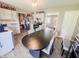 Eat-in kitchen featuring modern appliances, neutral cabinets and an adjacent dining area at 3613 N Locust St, Muncie, IN 47304