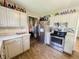 Well-equipped kitchen offering stainless steel appliances, wood laminate floor and ample storage at 3613 N Locust St, Muncie, IN 47304