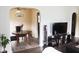 Charming dining area adjacent to living room, features dark wood table with seating and stylish decor at 3616 N Dearborn St, Indianapolis, IN 46218