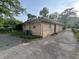 Back exterior view of a brick house showing the driveway and an AC unit at 3845 N Irvington Ave, Indianapolis, IN 46226