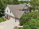 Aerial showcasing home with attached garage, basketball hoop, well maintained landscaping and pool in view at 4084 Mountbatton Dr, Greenwood, IN 46143