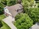 Aerial view showcasing a spacious home with a large driveway and well-maintained landscaping at 4084 Mountbatton Dr, Greenwood, IN 46143