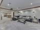 Finished basement with a projector screen, wet bar, and comfortable seating creating a versatile space for entertainment at 4084 Mountbatton Dr, Greenwood, IN 46143
