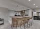 Finished basement bar area with seating and wood-trimmed countertop at 4084 Mountbatton Dr, Greenwood, IN 46143