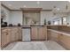 Basement wet bar featuring light wood cabinets and a mini refrigerator at 4084 Mountbatton Dr, Greenwood, IN 46143