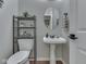 Powder room with modern fixtures, stylish mirror, and neutral decor at 4084 Mountbatton Dr, Greenwood, IN 46143