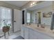 Bathroom features a double sink vanity, a large mirror, and neutral tile flooring at 4084 Mountbatton Dr, Greenwood, IN 46143