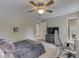 Comfortable bedroom featuring a ceiling fan, workstation, and plush decor for a relaxing atmosphere at 4084 Mountbatton Dr, Greenwood, IN 46143